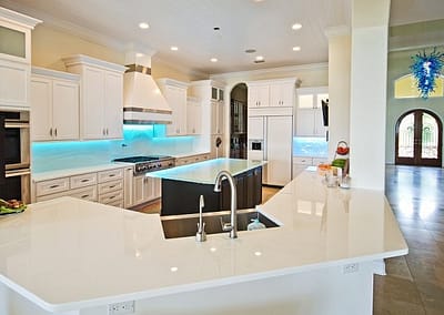 White Glass Countertop in modern kitchen in St petersburg Florida with textured glass backsplash