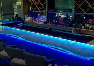 Glass bartop at Acqua Cafe West Palm Beach, Florida with LED illumination at night.