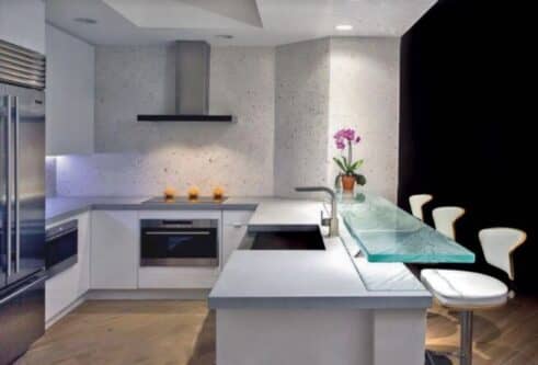 Kitchen glass bar top in Tampa Florida floating over concrete kitchen island