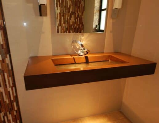 Floating Concrete and Glass sink with textured glass basin in Tampa Florida in golden brown color